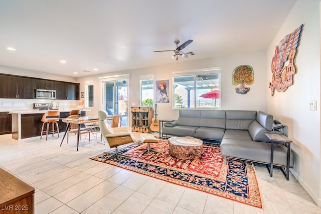 tiled living room with ceiling fan