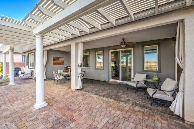 view of patio / terrace with ceiling fan and a pergola