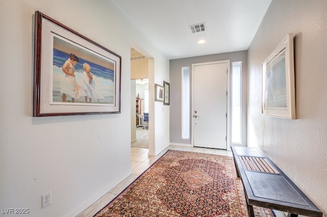 foyer with light tile patterned flooring