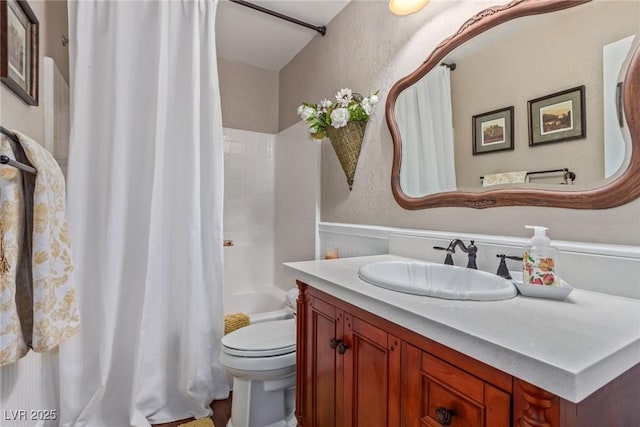 full bathroom with toilet, shower / bath combo, and vanity