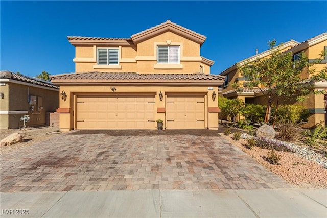 mediterranean / spanish-style house featuring a garage