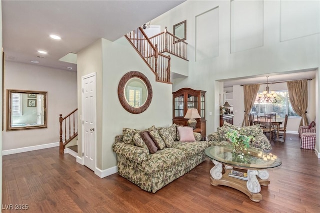 living room with a notable chandelier and hardwood / wood-style floors