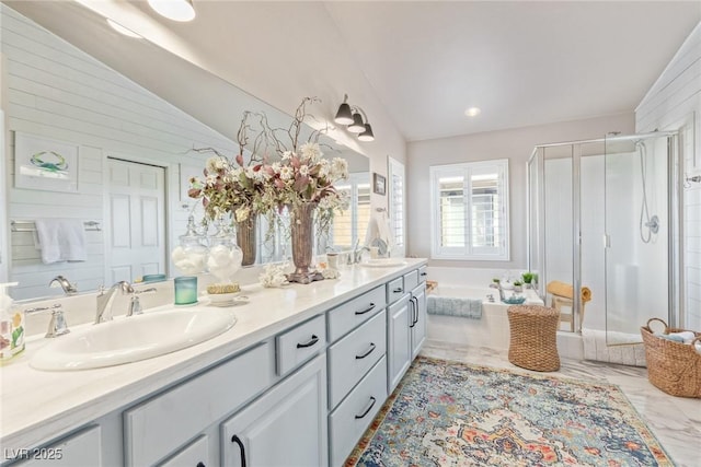 bathroom featuring vanity, vaulted ceiling, and plus walk in shower