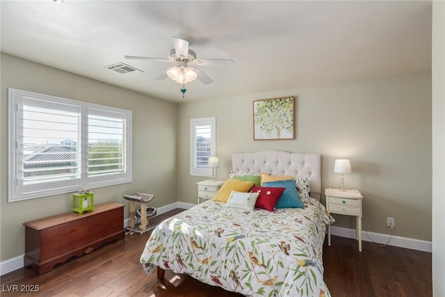 bedroom with ceiling fan and dark wood-type flooring