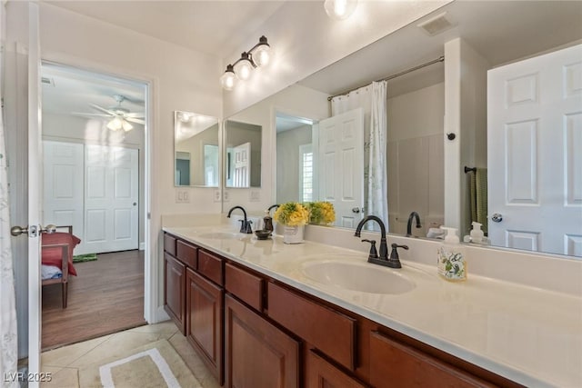 bathroom with ceiling fan, vanity, and tile patterned floors