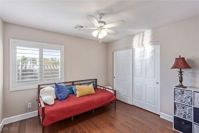 sitting room with ceiling fan and dark hardwood / wood-style floors