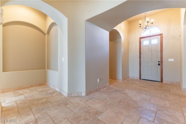 entryway featuring an inviting chandelier