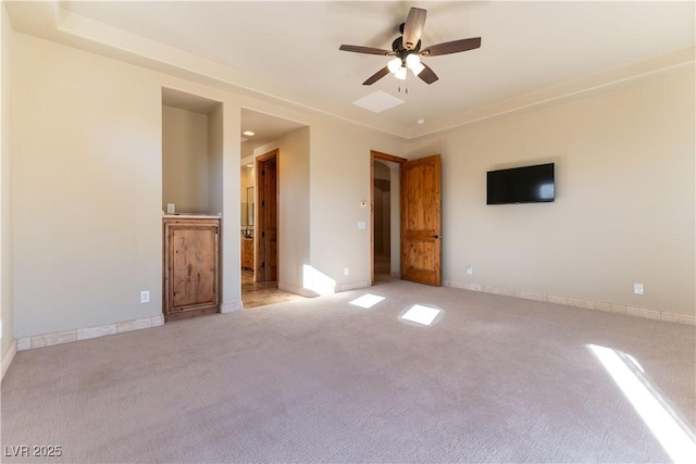 unfurnished bedroom featuring ceiling fan and light carpet