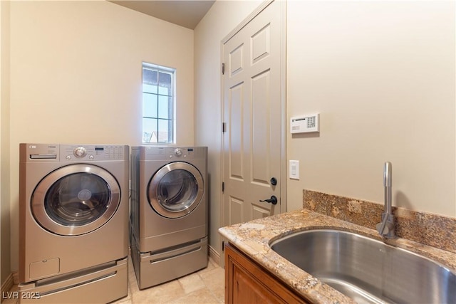 laundry room featuring separate washer and dryer and sink