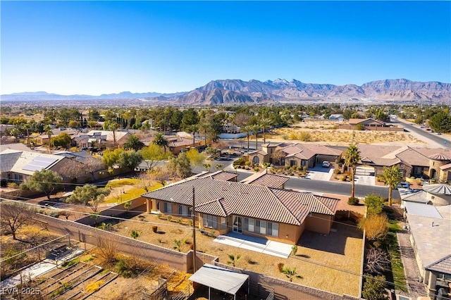 birds eye view of property featuring a mountain view