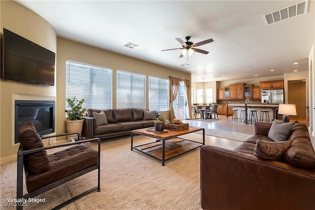 living room with ceiling fan