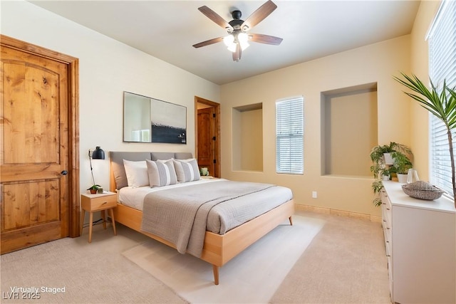 carpeted bedroom with ceiling fan