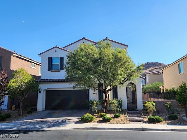 mediterranean / spanish-style home featuring a garage