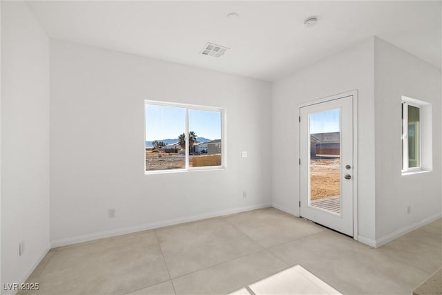 view of tiled spare room