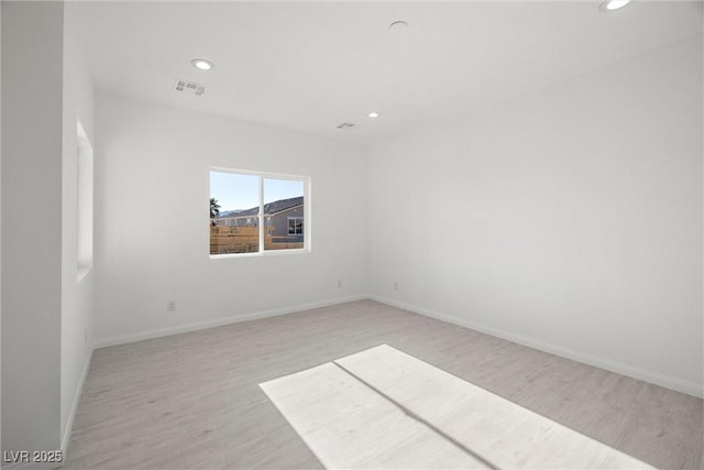 unfurnished room featuring light hardwood / wood-style flooring