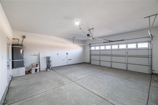 garage featuring secured water heater and a garage door opener