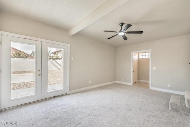 unfurnished room featuring french doors, carpet flooring, ceiling fan, and beam ceiling