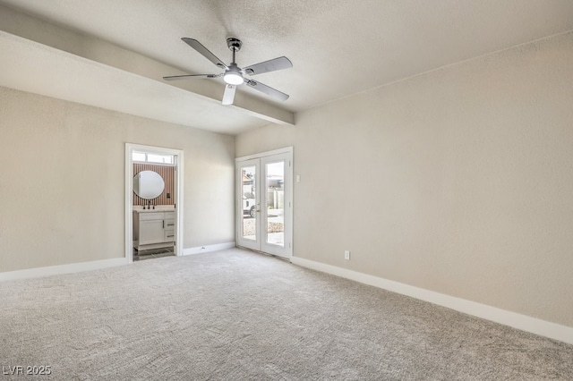 unfurnished room with ceiling fan, french doors, and carpet