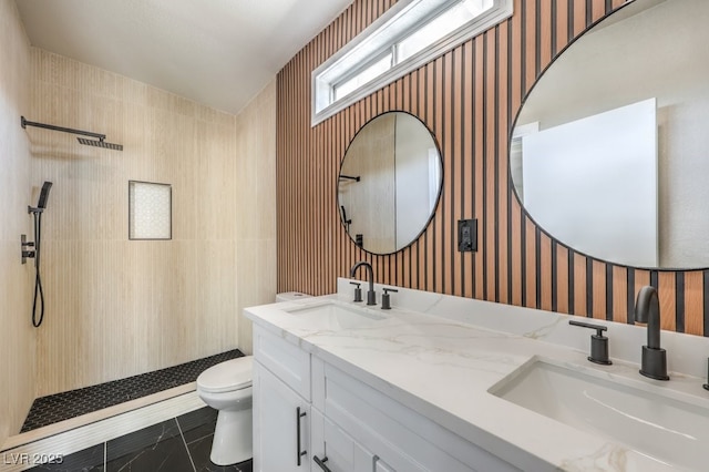 bathroom with toilet, walk in shower, and vanity