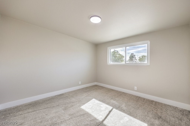 unfurnished room with light colored carpet