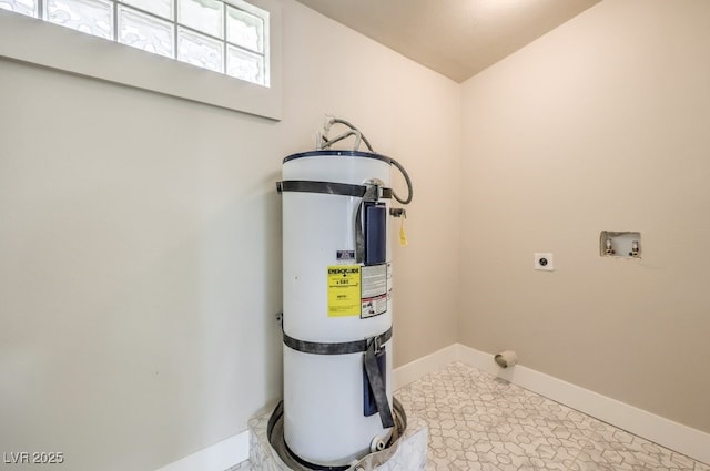 utility room with strapped water heater