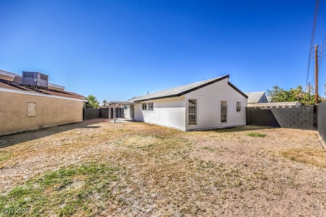 rear view of house with central AC