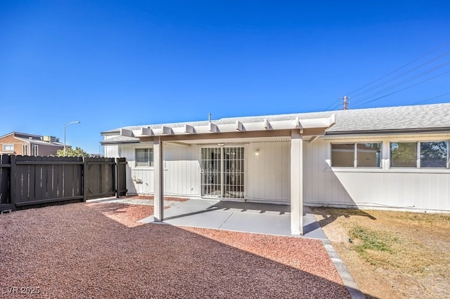 back of house with a patio