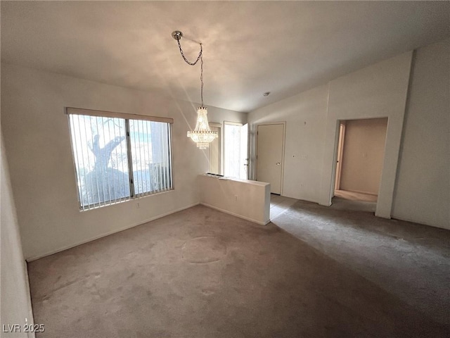 spare room with lofted ceiling and carpet flooring