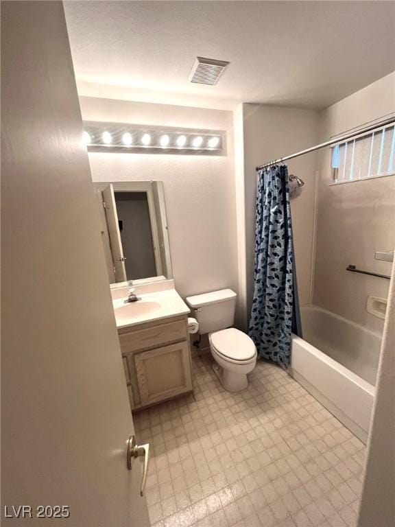 full bathroom with toilet, vanity, and shower / bath combo with shower curtain