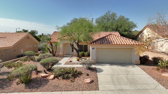 mediterranean / spanish-style home with a garage