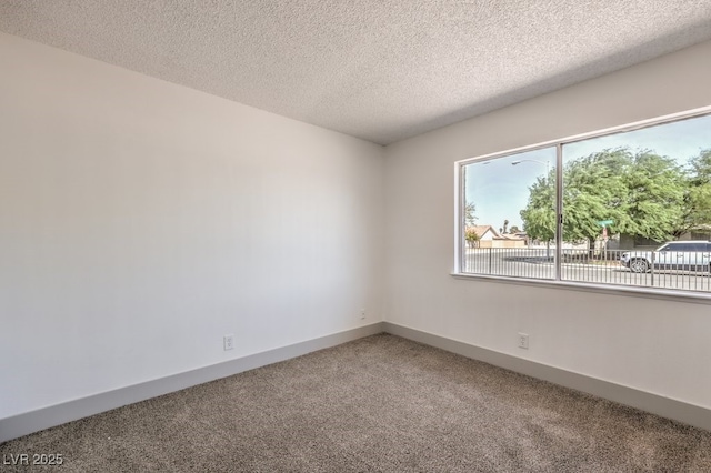 spare room with a textured ceiling