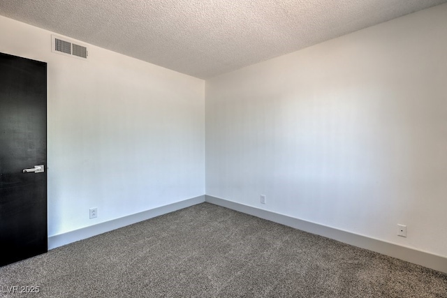 unfurnished room featuring a textured ceiling