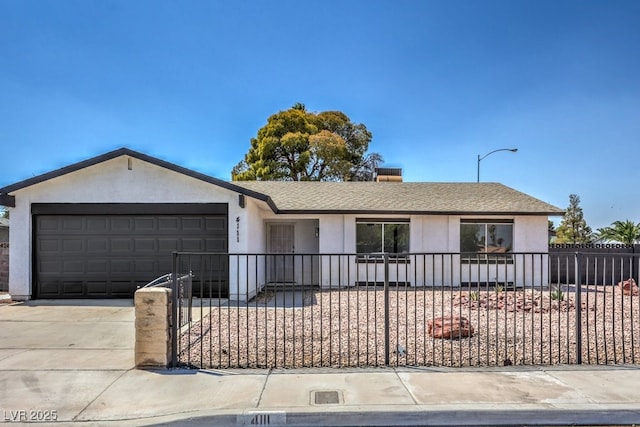 single story home featuring a garage