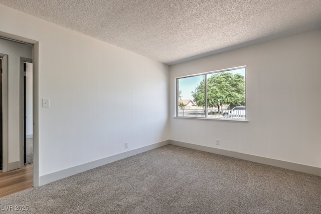 empty room featuring a textured ceiling