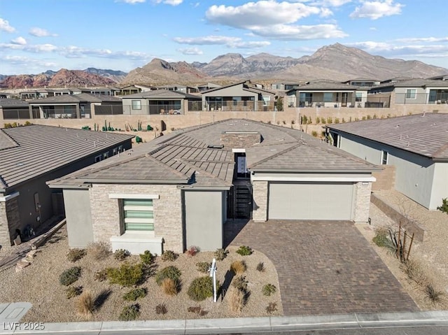 birds eye view of property featuring a mountain view