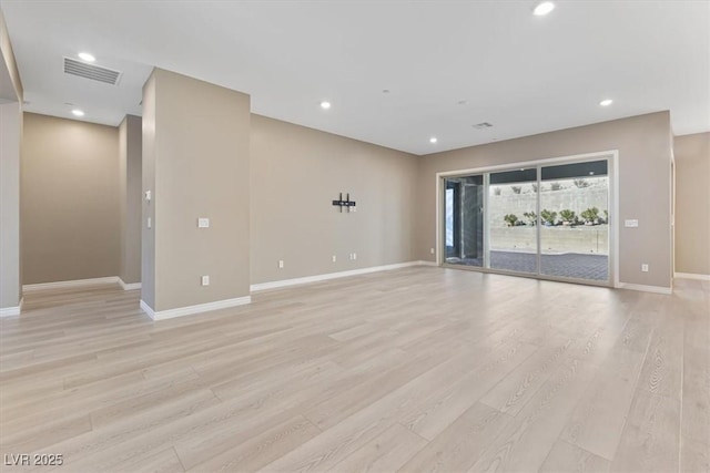 unfurnished room with light wood-type flooring