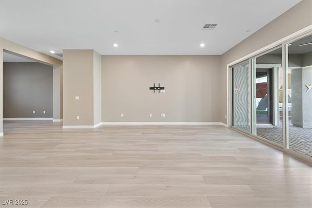 unfurnished room featuring light hardwood / wood-style flooring