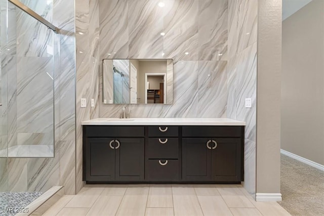 bathroom with vanity and a shower