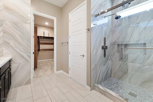 bathroom with an enclosed shower and vanity