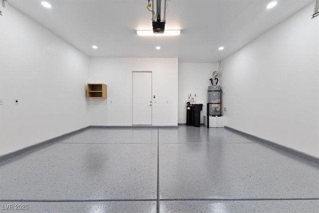 garage featuring secured water heater and a garage door opener