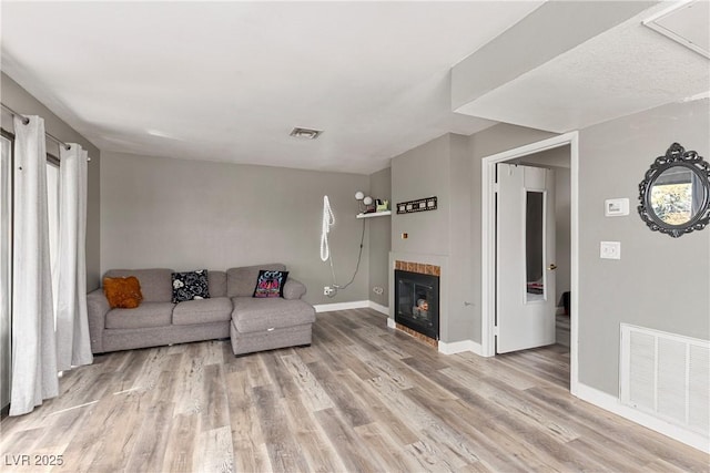 living room with light hardwood / wood-style floors