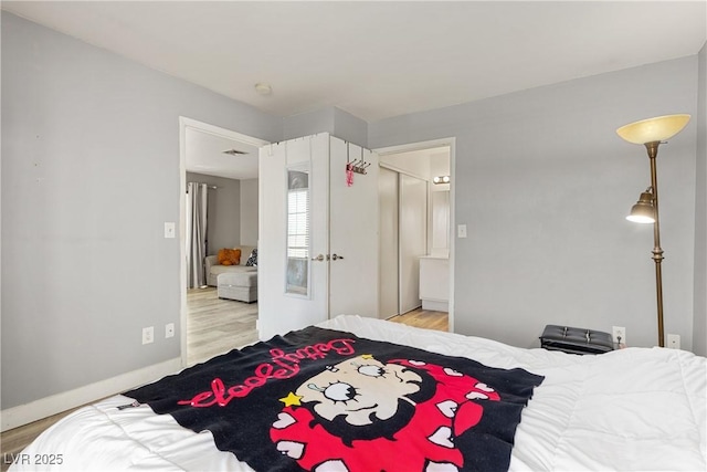 bedroom featuring light wood-type flooring