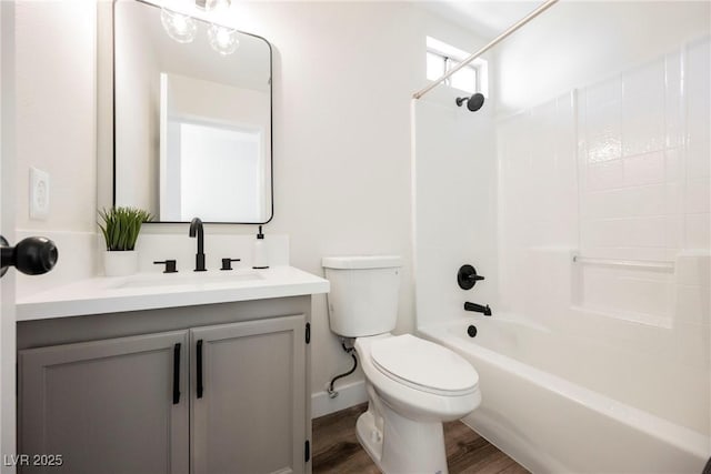 full bathroom with shower / bathing tub combination, vanity, toilet, and hardwood / wood-style floors