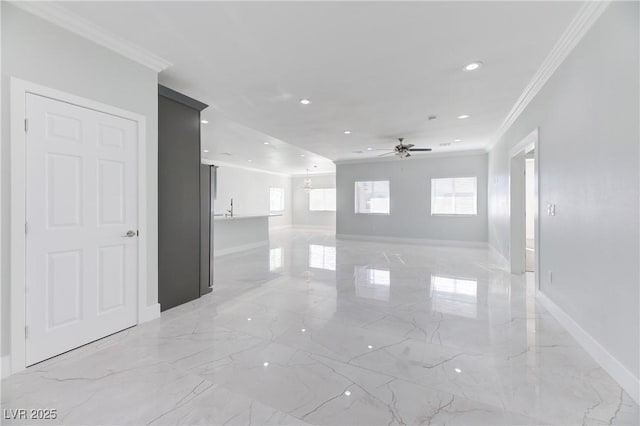 unfurnished room with marble finish floor, ornamental molding, recessed lighting, and baseboards