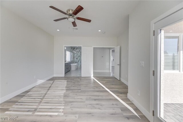 interior space with light wood-type flooring and ceiling fan