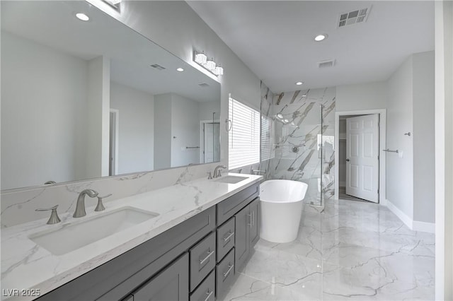 bathroom featuring a sink, visible vents, a freestanding bath, marble finish floor, and a marble finish shower