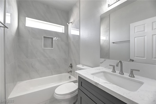 full bath featuring bathtub / shower combination, vanity, and toilet