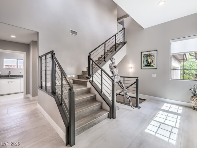 staircase featuring sink