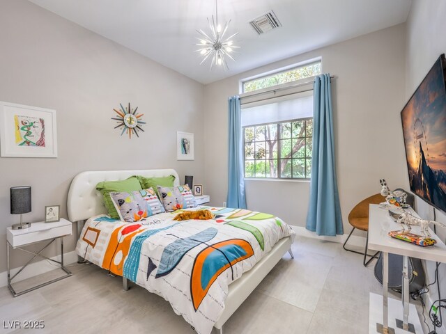 bedroom featuring an inviting chandelier