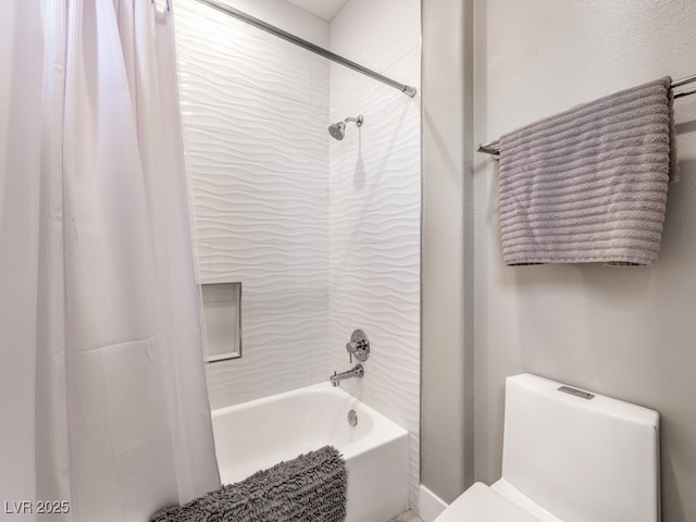 bathroom featuring toilet and shower / tub combo